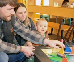 parents with infant at kids museum