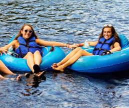 two women lazy river tubing