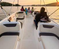 people on a boat on lake george