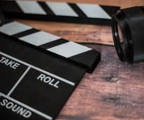 closeup of camera and clapperboard 