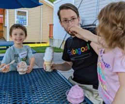 dad and kids eat ice cream
