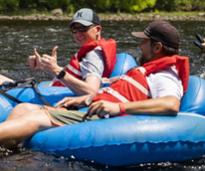two men lazy river tubing