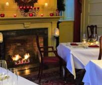 romantic restaurant with fire in fireplace