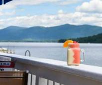 A drink on the railing of Lake George beach club.