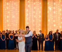 A couple's first dance in the Hall of Springs.