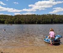 people in water at luzerne state campground