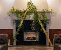 wedding arch over fireplace in hotel lobby