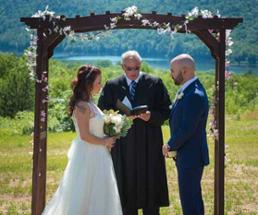 A couple says their vows atop a mountain at Garnet Hill Lodge.