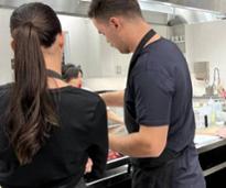 couple takes a cooking class