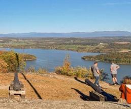 people at mount defiance in ticonderoga in the fall