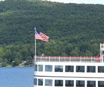 american flag on the bow of a steamboat