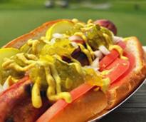 elaborate hot dog against backdrop of golf course