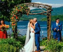 couple getting married by a lake