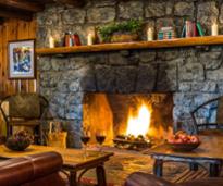 wine glasses by fire in lodge