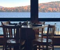 restaurant table with foliage views through window