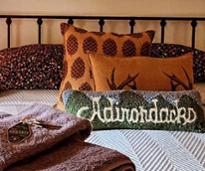 adirondacks pillow on bed