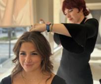 a woman getting her hair done