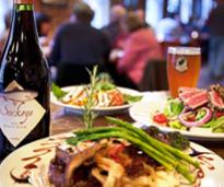 food, wine, and beer on a table
