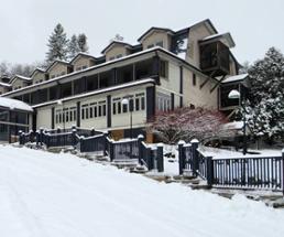 exterior of friends lake inn in winter