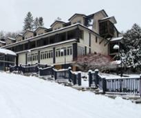 exterior of friends lake inn in winter