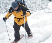 winter hiker with snowshoes