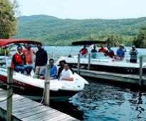 group of guys on two boats