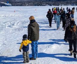 dad with kid at lake george winter carnival