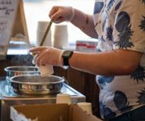 person serving chowder