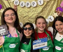 young girls pose at birthday party