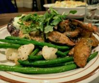 plated meal with potato wedges and green beans