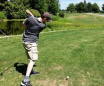 man swinging golf club