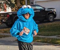 guy running in cookie monster costume