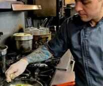 chef cooking on stove