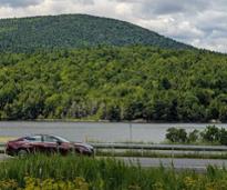 car driving through adirondacks