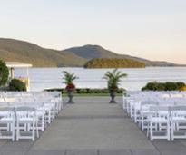 outdoor wedding ceremony setup by a lake