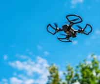 drone flying over trees