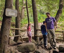 family at natural stone bridge and caves