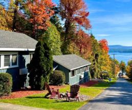 fall colors on trees near hotel and the lake