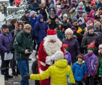 santa meeting families outdoors in Lake Placid NY