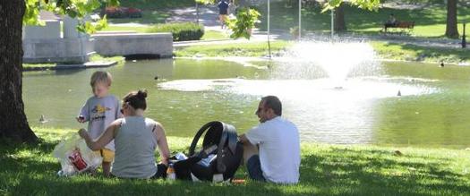 family sitting in a park