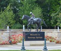 horse statue and welcome sign