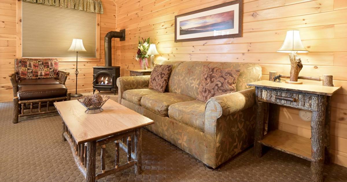 rustic living room with couch and fireplace