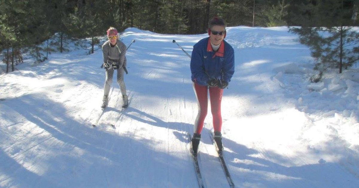 two women cross country skiing