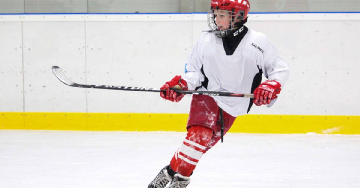 a kid playing hockey