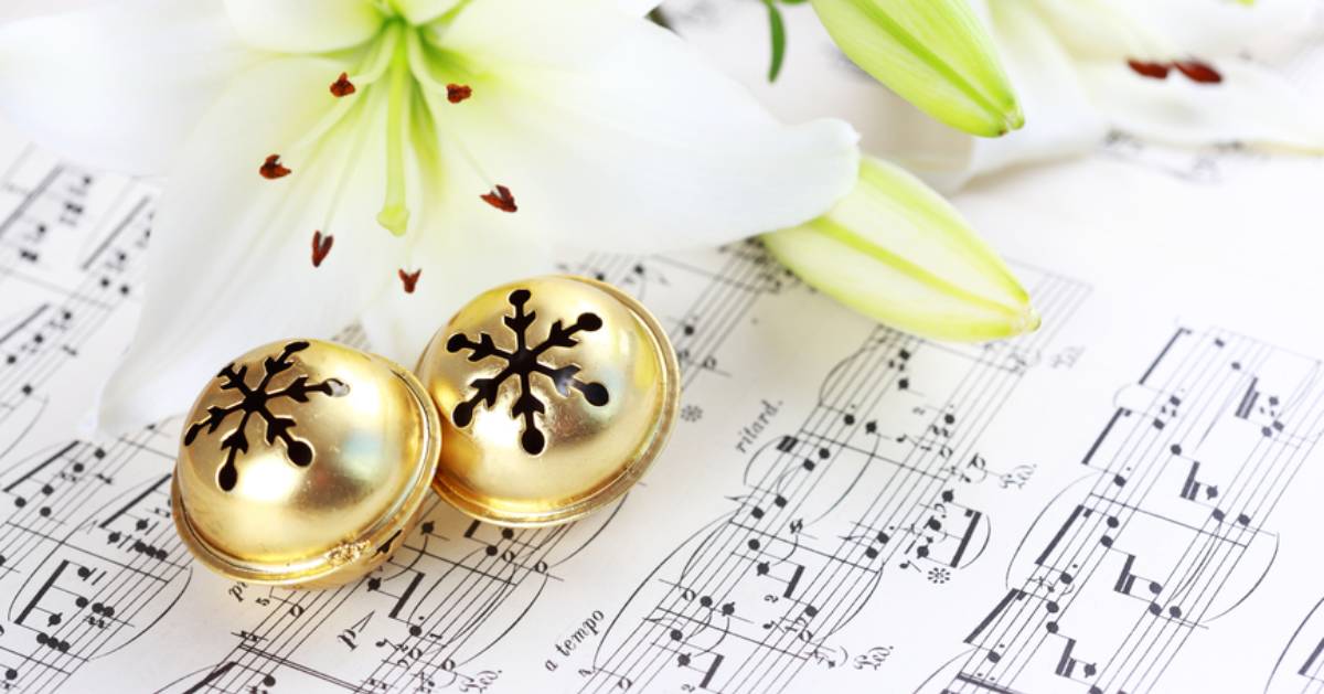 bells on music sheet with flower