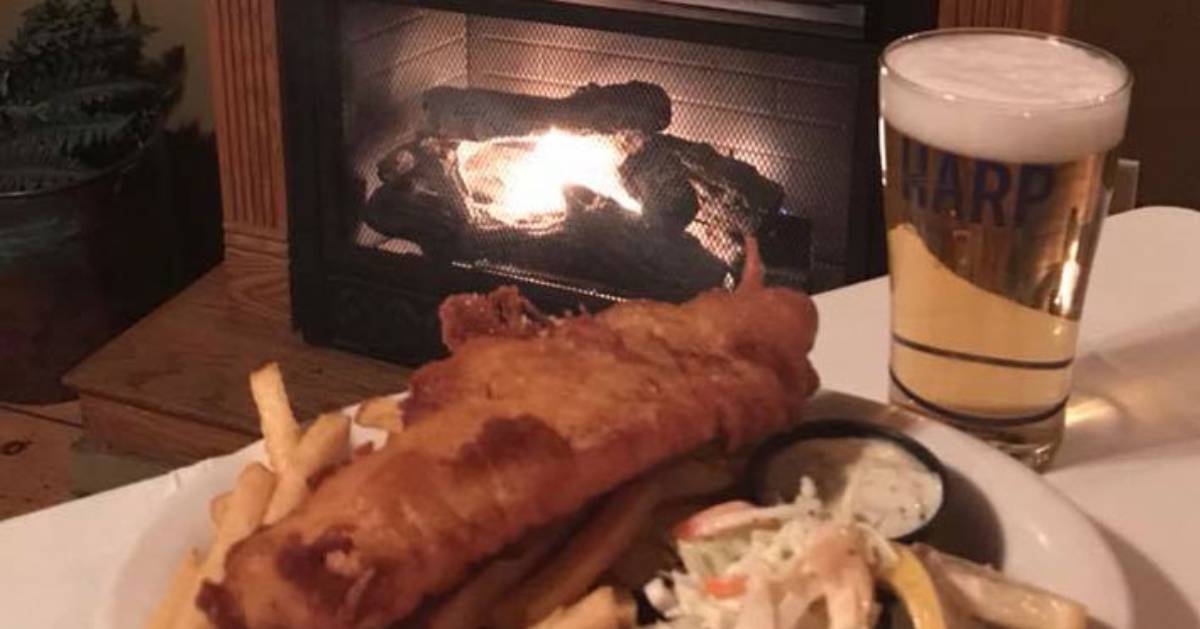 beer and fried fish by a fireplace
