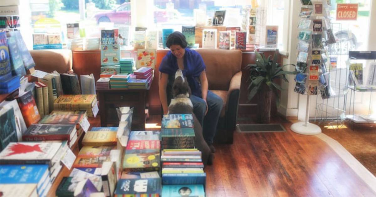 woman and dog in bookstore