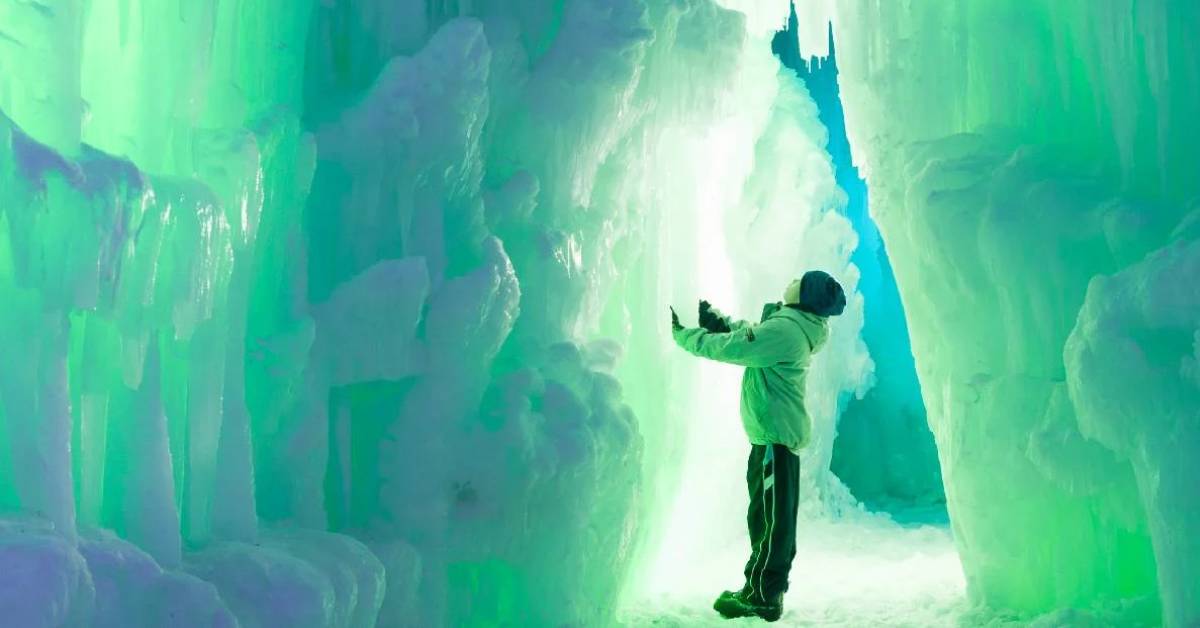 young boy standing in ice castle
