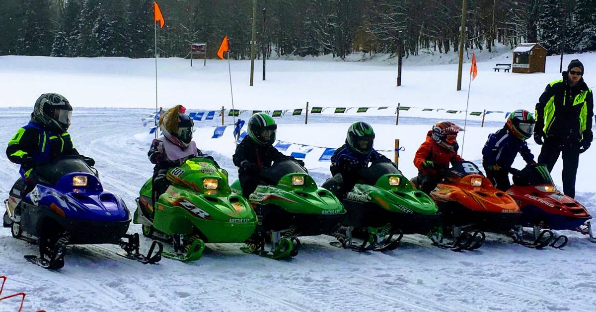 kids on snowmobiles lined up