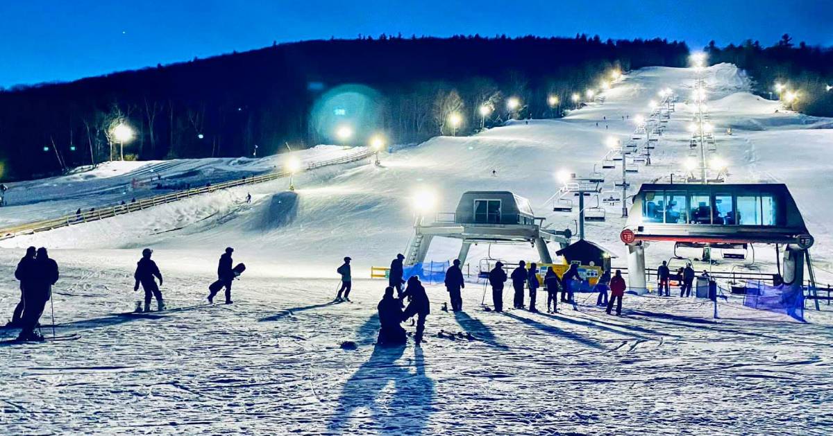 skiers at West Mountain at night